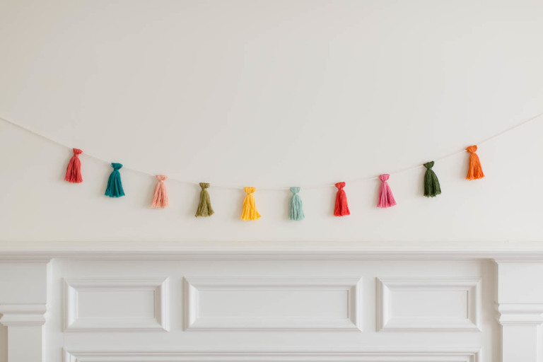 This DIY Mini Tassel Garland is an easy way to add a little color and cheer to any situation!