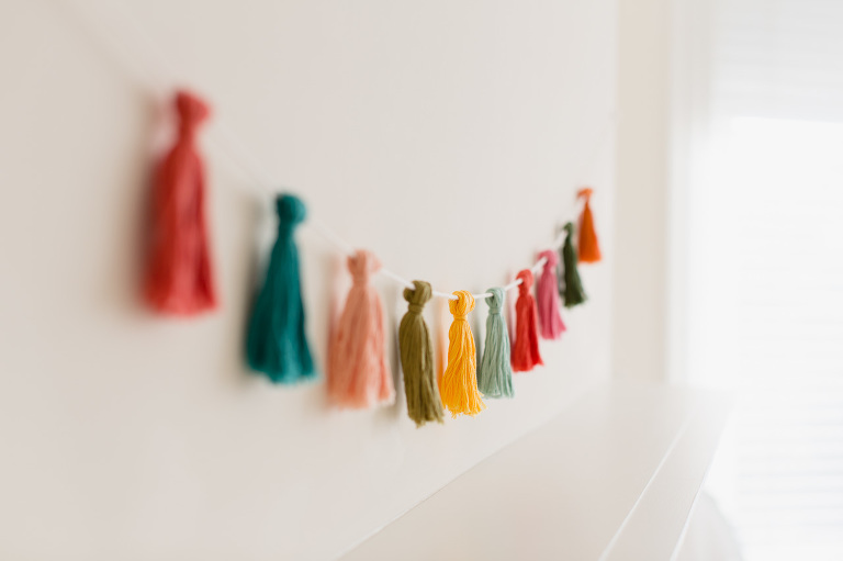 This DIY Mini Tassel Garland is an easy way to add a little color and cheer to any situation!