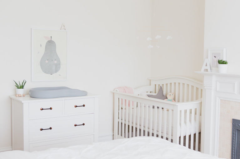 baby nursery in corner of master bedroom