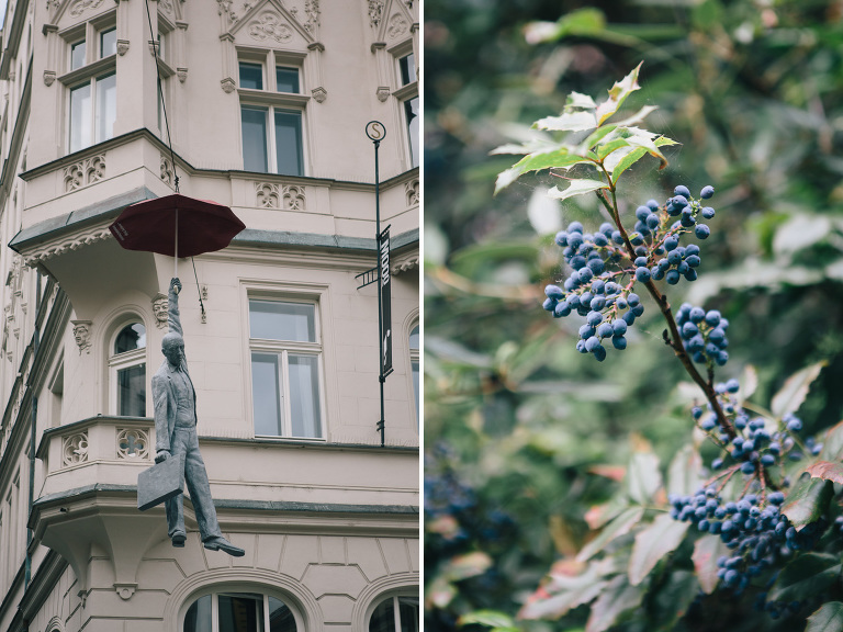Man hanging from umbrella in Prague